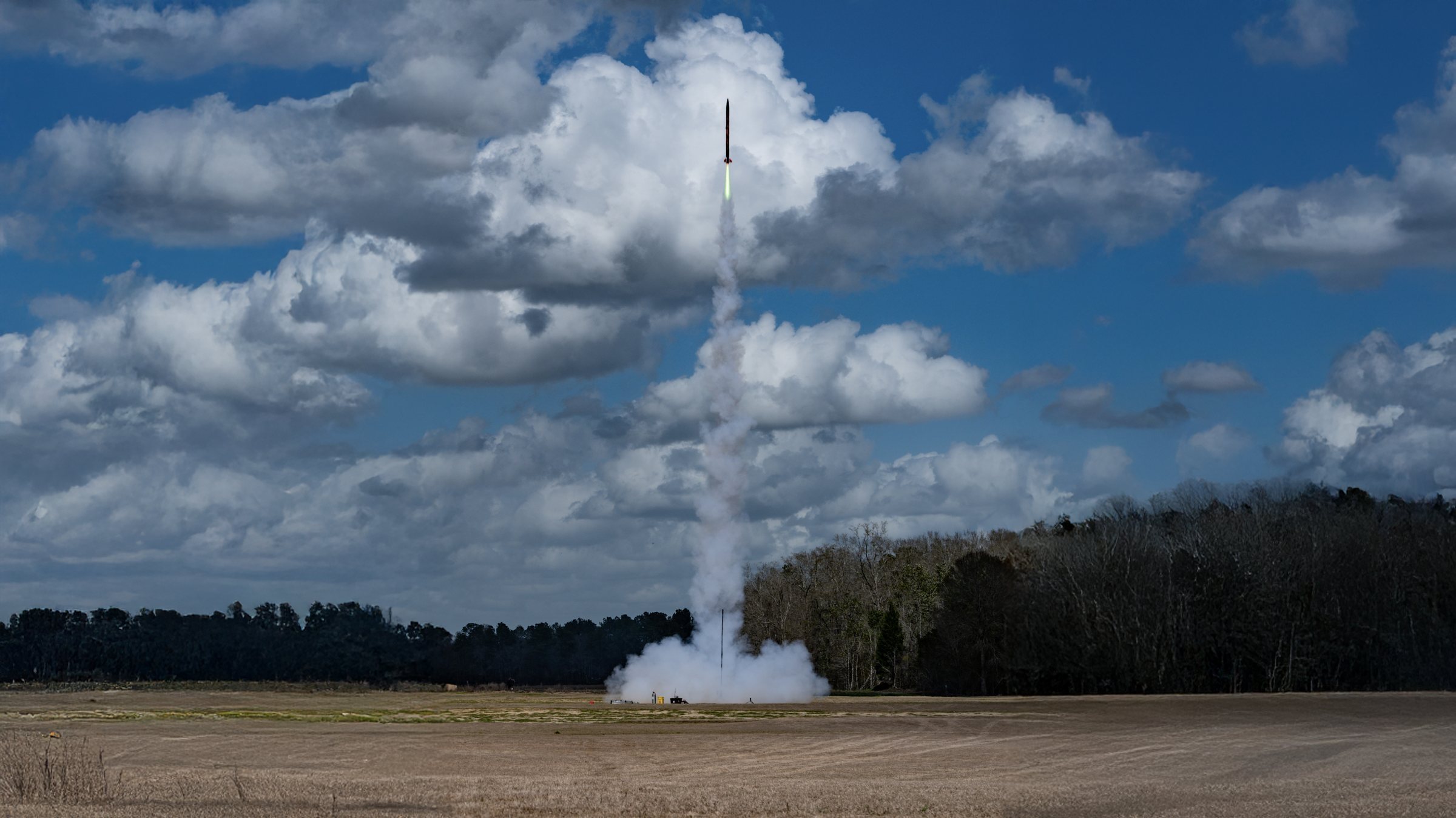 Swamp Launch rocket ascending through clouds